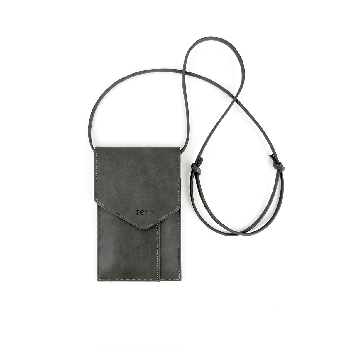 A solid grey leather crossbody phone bag with a magnetic flap closure and a thin adjustable strap, featuring the brand name 'tern' debossed on the front, shown on a plain white background.
